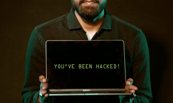 Free Man Holding Laptop Computer With Both Hands Stock Photo